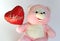 Teddy bear with heart balloon