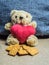 Teddy bear with a heart that loves bread