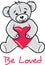 Teddy bear holding a heart. Be loved