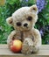 Teddy-bear Lucky with an apple a