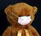 Teddy bear in a mask. Get vaccinated to get rid of the mask.Covid-19.