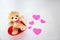 Teddy bear and pink hearts on white background, valentine`s day, advertising baner