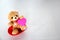 Teddy bear and pink hearts on white background, valentine`s day, advertising baner