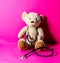 Teddy bear with stethoscope for checking an injury after mishap