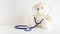 Teddy bear with a stethoscope. Pediatrician healthcare for children.