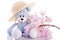 Teddy bear stuffed animal with pink blossom