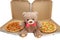 A Teddy bear with two pizzas