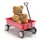 Teddy bear in the vintage child`s toy mini wagon