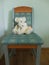 Teddy bears on a turquoise chair