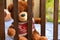 Teddybear is sitting in the crib, a photo on the children`s theme, in the children`s bedroom, interior design, cute fluffy bear