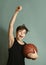 Teeb boy with basketball ball score goal gesture