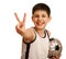 Teen with a ball showing a victory sign