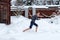 Teen barefoot runs in the snow. Winter day. Hardening