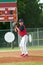 Teen baseball boy ready pitch from the mound.