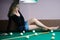 Teen on billiard table