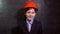 Teen boy builder in helmet smiling portrait