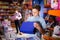 Teen boy with carton box in toy store