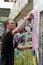 Teen boy concentrating on painting graffiti