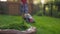 Teen boy cutting grass with electric lawn mower