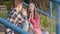 Teen boy and girl sitting on stairs