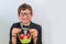 Teen boy with glasses with a small basket with gifts