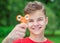 Teen boy with spinner toy in park