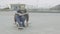 Teen boy tying shoelaces sitting on skateboard