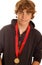 Teen boy wearing winning medal