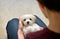 Teen boy with white puppy maltese dog