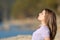 Teen breathing fresh air sitting in a lake