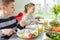 Teen brother and sister eating healthy breakfast at home