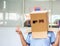 Teen with carton head mask