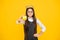 Teen child in queen crown hold apple isolated on yellow background. Princess girl in tiara. Teenage girl wear diadem.