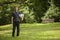 Teen child soccer player. Football Boy with ball on green grass