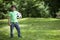 Teen child soccer player. Football Boy with ball on green grass