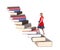 Teen climbing a staircase of books