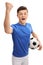 Teen football player looking at the camera and gesturing happiness
