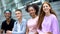 Teen friends smiling camera sitting outdoors, youth generation, happy classmates