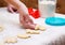 Teen girl bakes homemade cookies. hands closeup