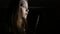 Teen girl with a big knife, horror movie dark scene, 4K UHD