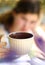 Teen girl with book hold tea cup close up photo