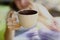 Teen girl with book hold tea cup close up photo