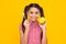 Teen girl brush her teeth, dental healthy concept, isolated over yellow background. Healthy kids teeth. Apple vitamins