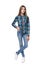 Teen girl in checkered shirt standing casually