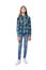 Teen girl in checkered shirt standing casually looking up