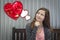 Teen Girl Daydreaming of Valentine Hearts with Red Roses