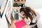 Teen girl dozed off on her desk while doing homework