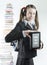 Teen girl with ebook and stack of printed books