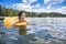 Teen girl floating in an inflatable tube at the lake on a warm summer day