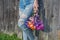 Teen girl with frayed jeans and daisies